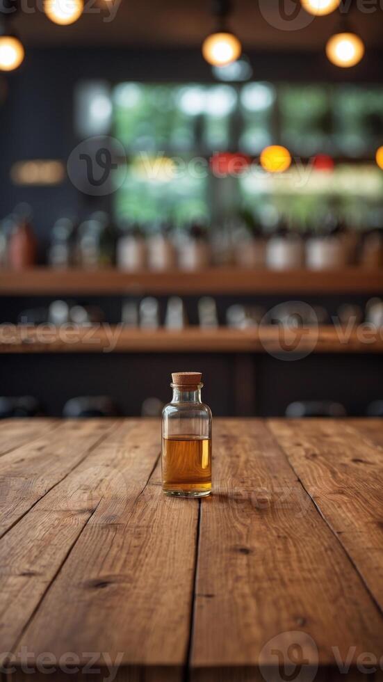empty the top of wooden table with blurred counter bar and bottles background. photo