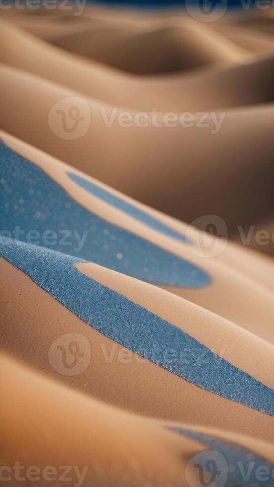 sand dunes background in peach fuzz and blue colors. photo