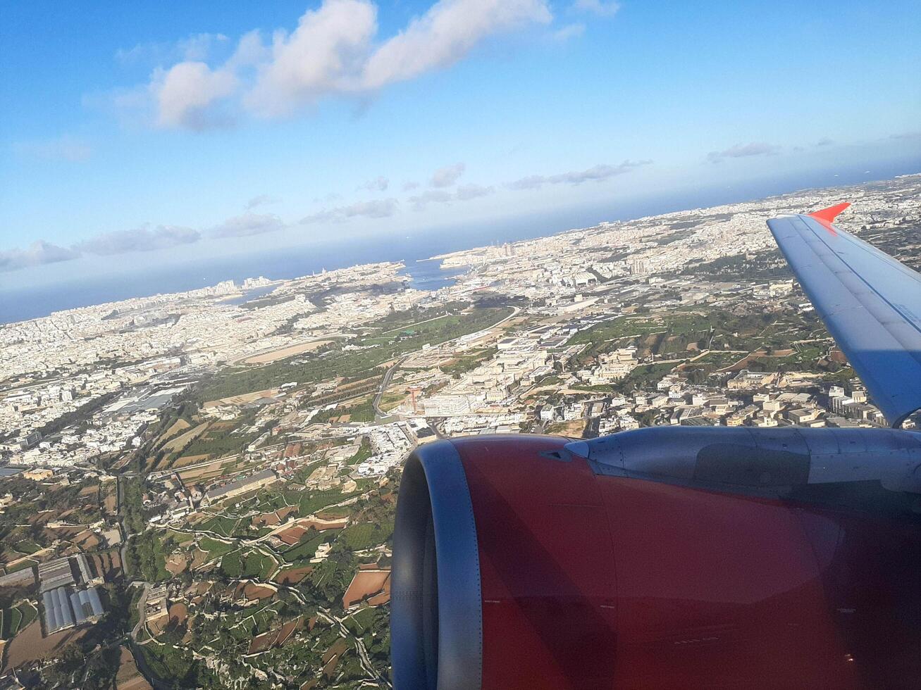Stunning panoramic view from an airplane on a bright, sunny day. photo