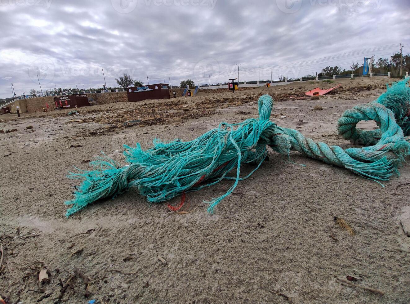 Rope on the Beach Washed Ashore from the Sea photo