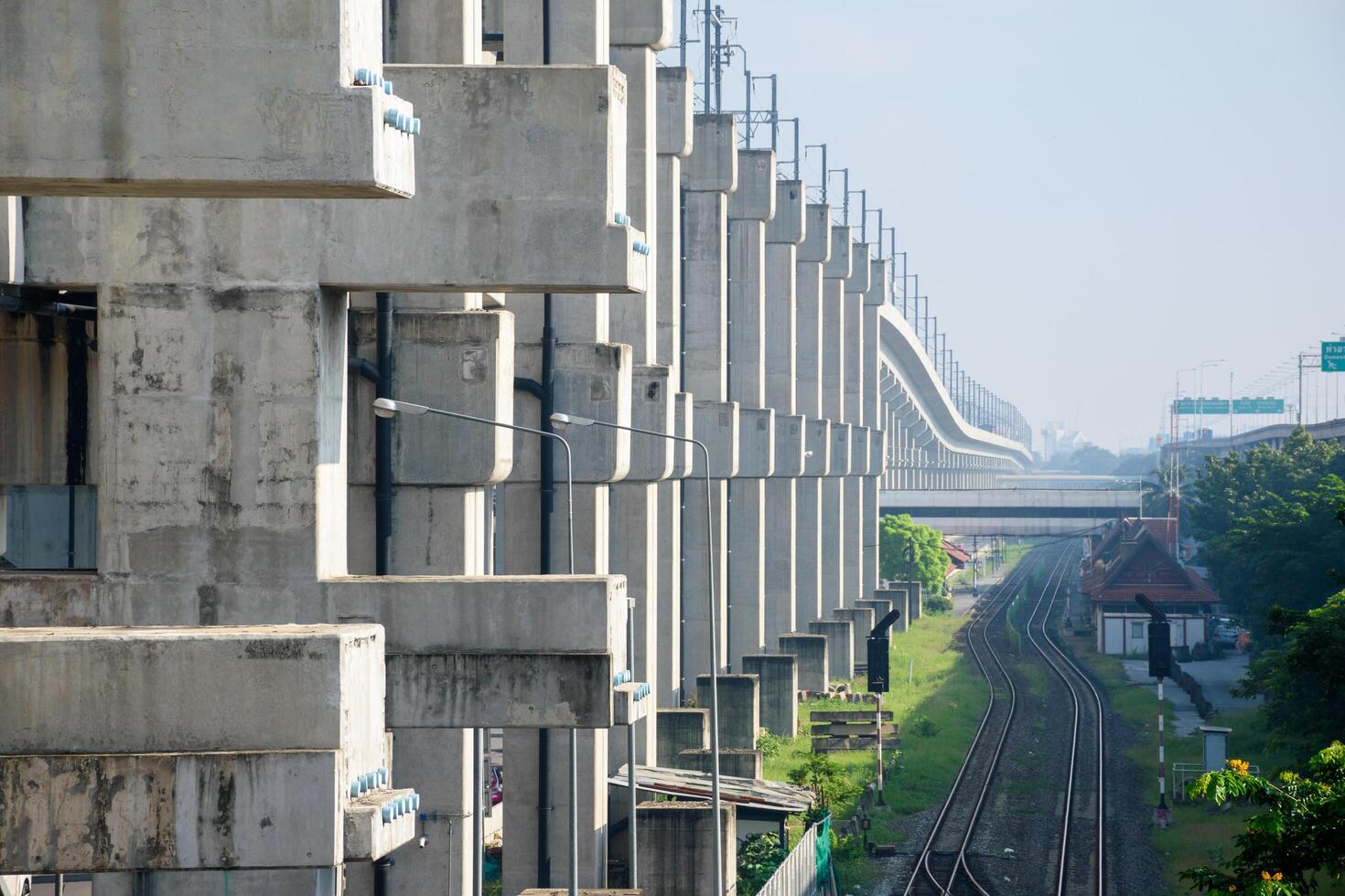 Bangkok, Thailand - October 13, 2024, Concrete pillars and high-speed railway structures, Red Line Electric Train, tracks is public transport system, SRT, Railway stations and tracks photo