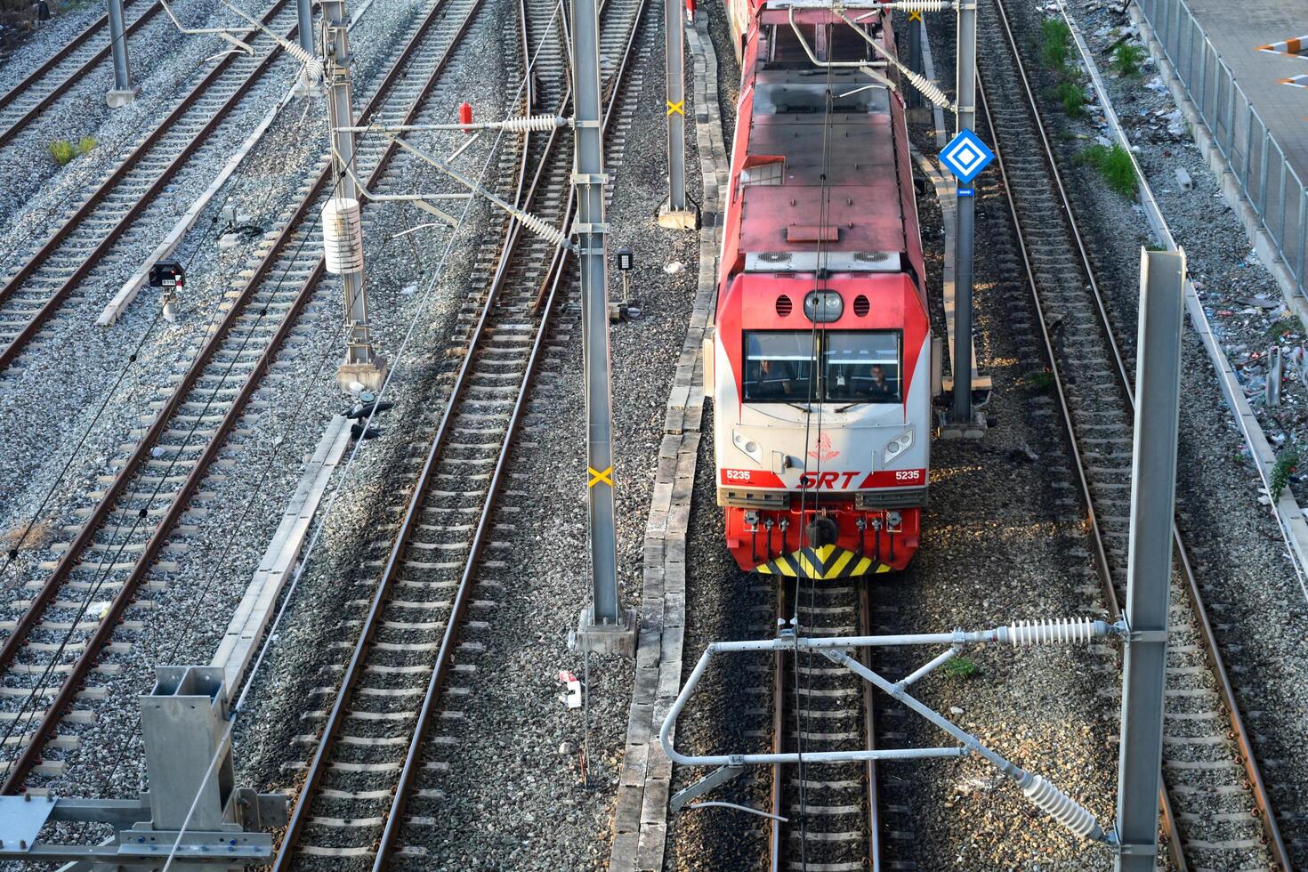 Bangkok, Thailand - October 13, 2024, Red Line Electric Train running on the tracks is public transport system. Commuter train of the state railway of Thailand SRT, Railway stations and tracks. photo