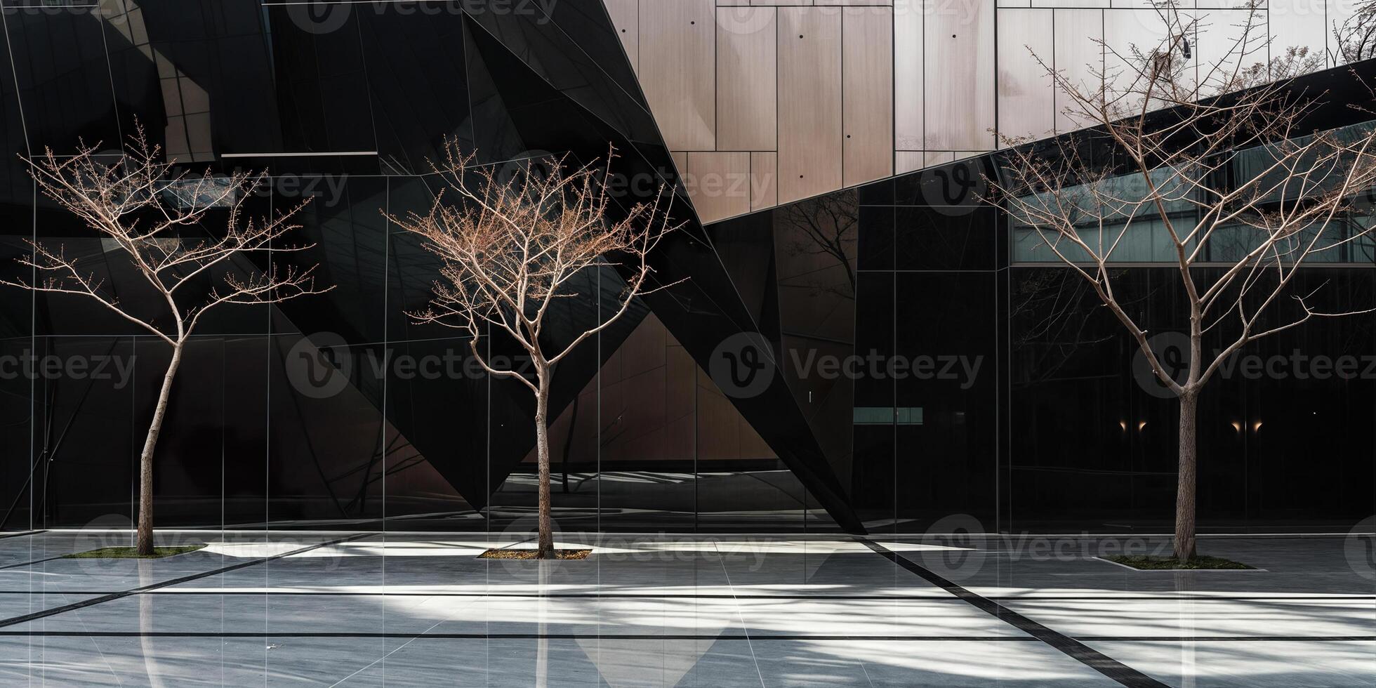 Leafless trees standing in front of modern office building photo