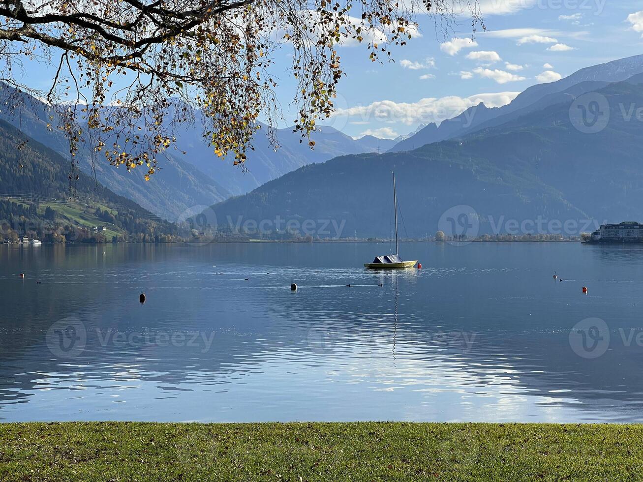 Beautiful view of Zell am See lake in Austria. Green landscape at the background Alps mountains photo