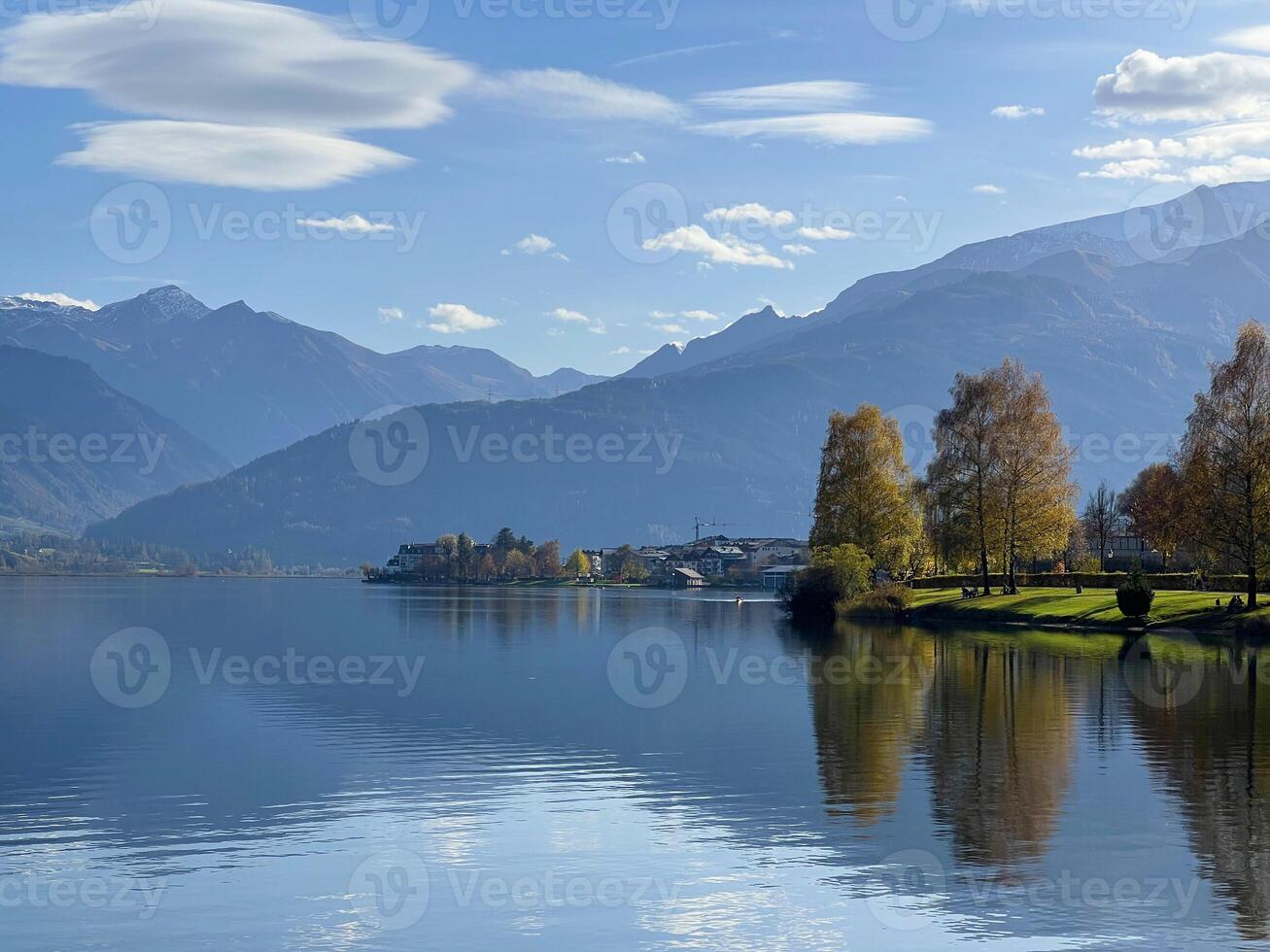 Beautiful view of Zell am See lake in Austria. Green landscape at the background Alps mountains photo