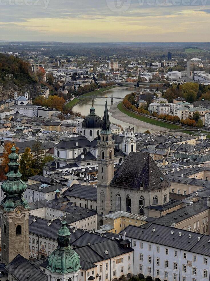 Autumn panoramic view of the center of Salzburg old town and Salzach river close up from above photo
