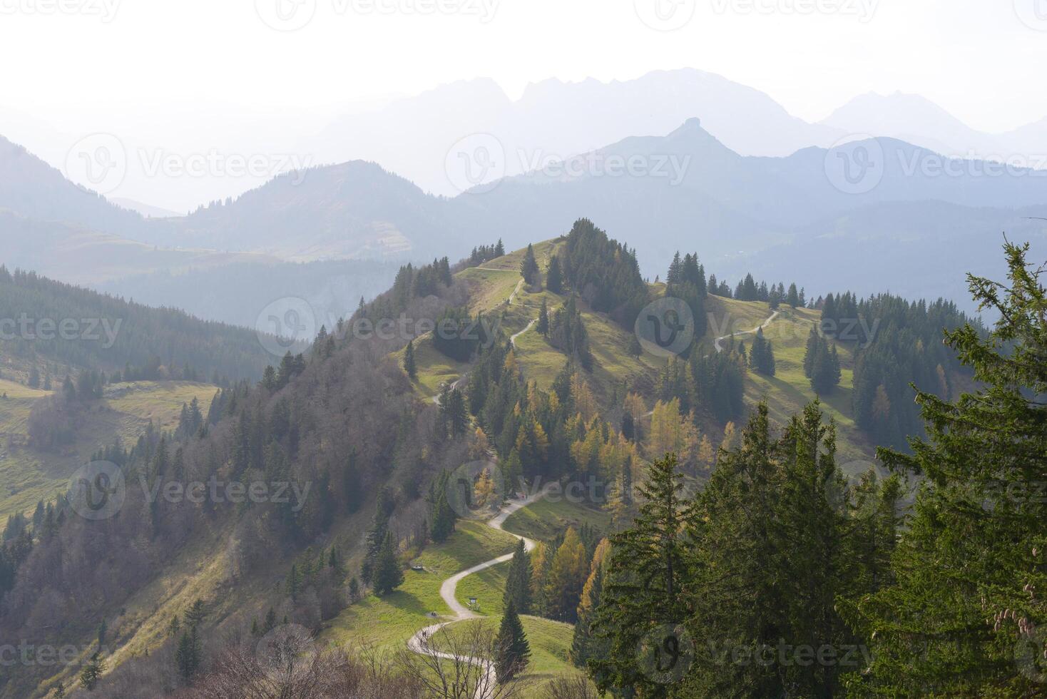 Autumn Alpine mountain landscape. Scenic walking path on the Zwolferhorn peak in Sankt Gilgen, Austria. Panoramic view photo