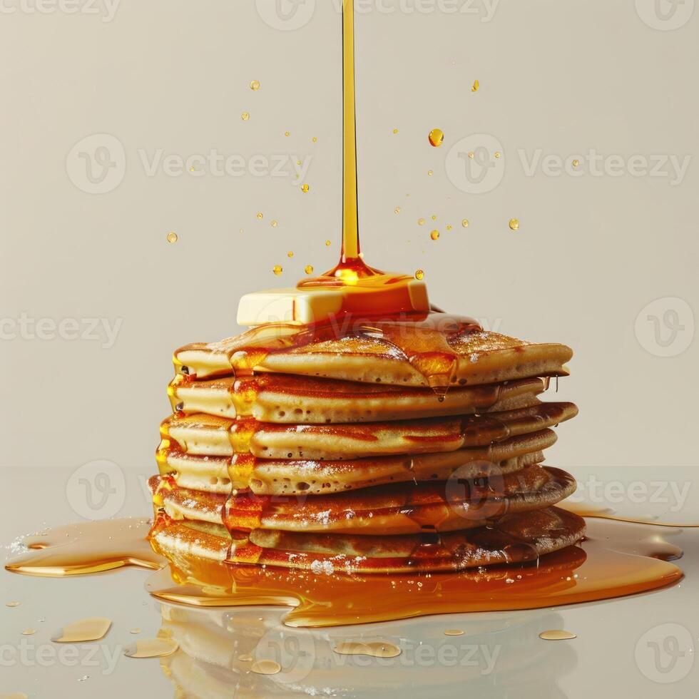 a stack of pancakes with syrup being poured on top photo