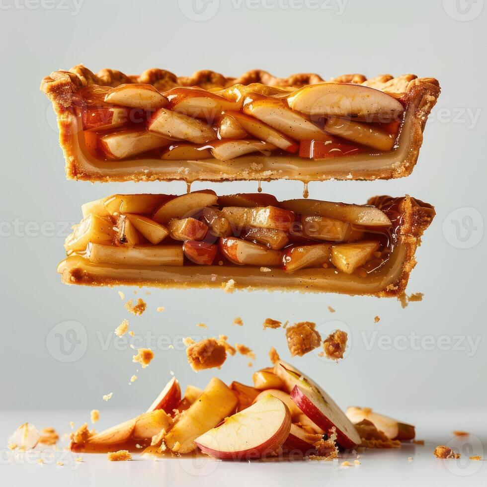 two pieces of apple pie falling into the air photo