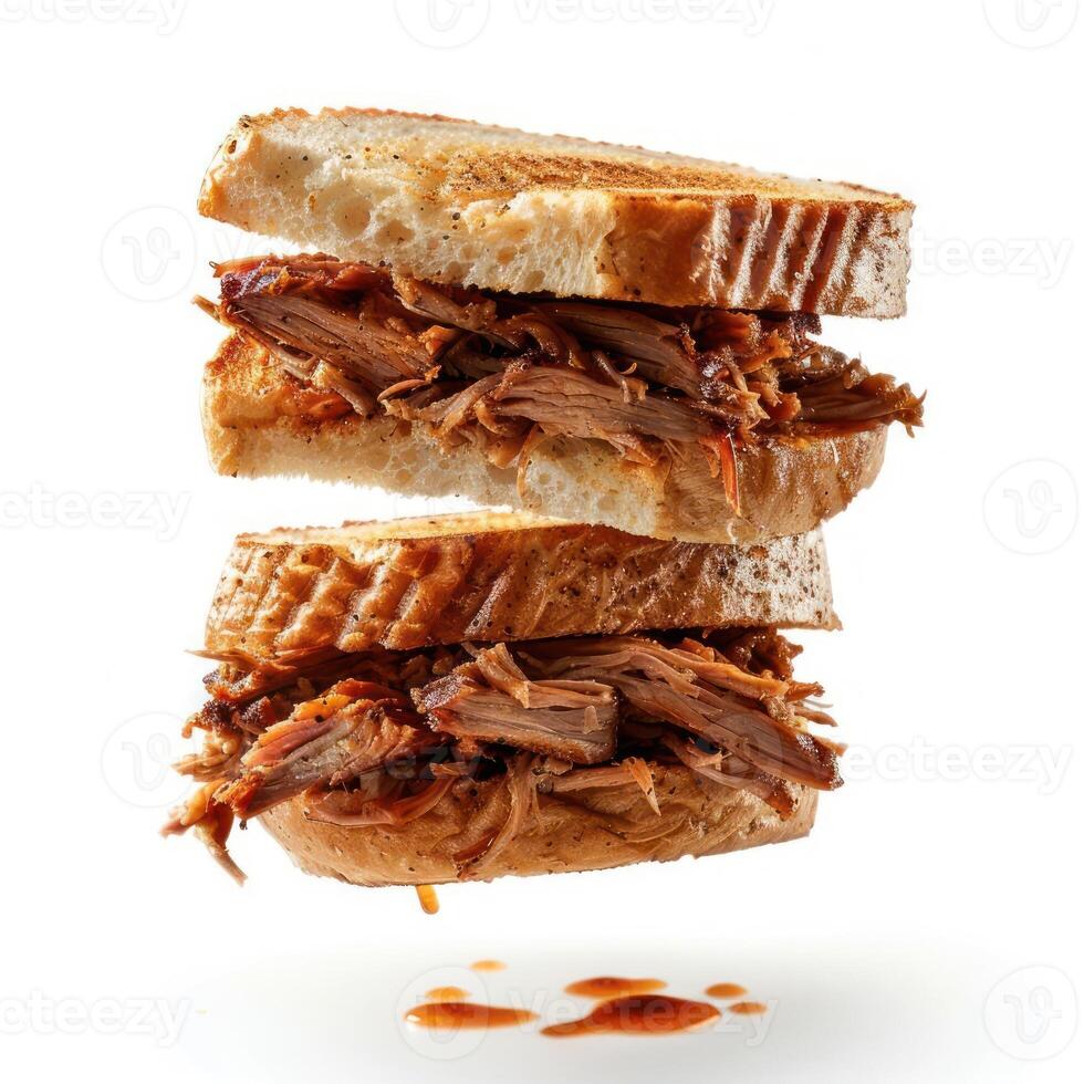 a cut in half sandwich sitting on top of a white table photo