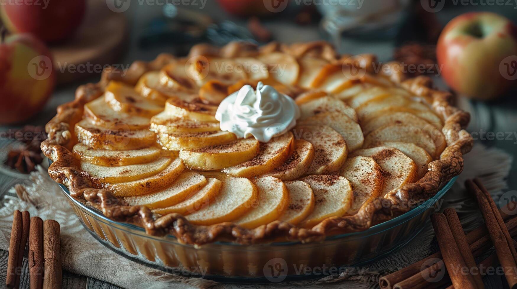 a pie topped with sliced apples and whipped cream photo