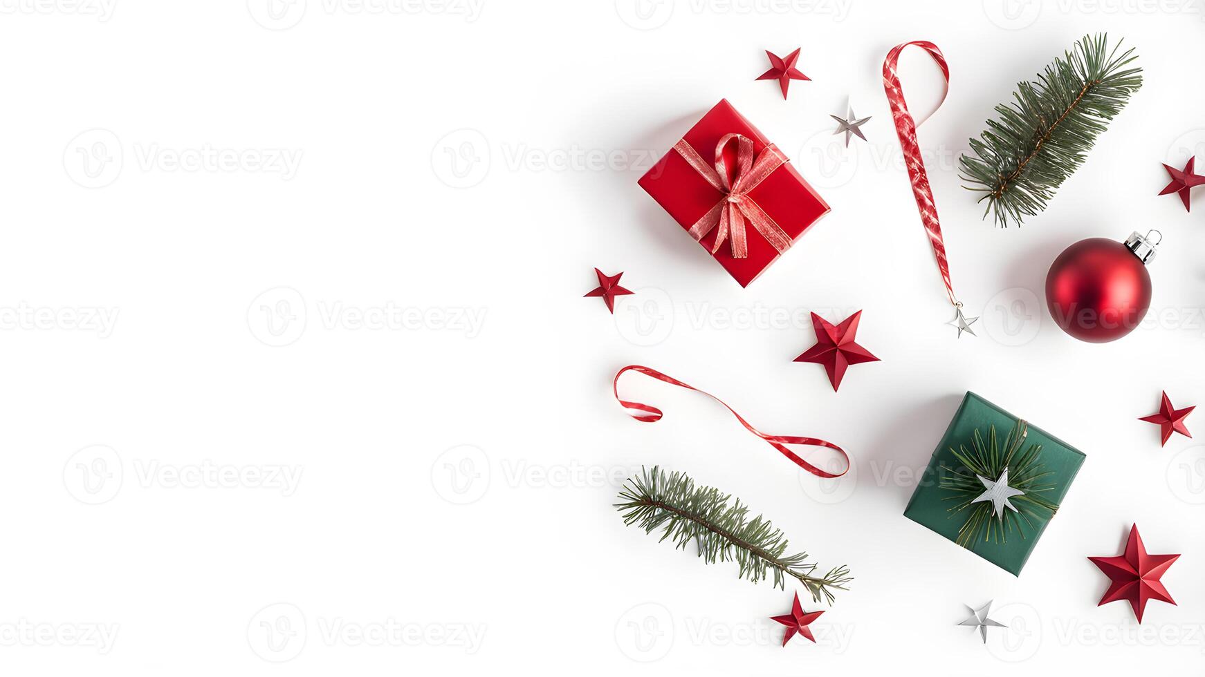 Top view layout with left blank space adorned pine tree branch, red ball, gift box, ribbon and star on white background like snow photo