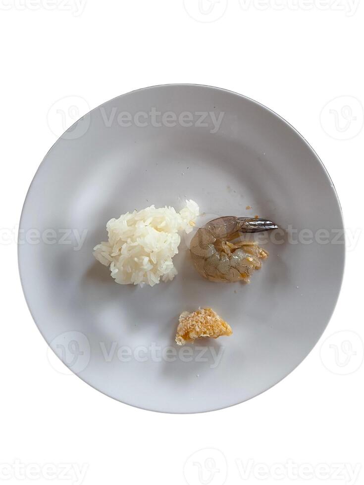 Sticky rice with pork rinds and fresh shrimp on a white plate, isolated on a white background. photo
