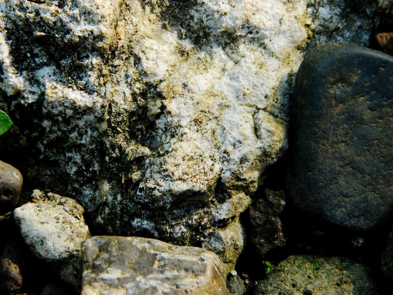 Abstract background with mountain rocks. Large shaped rocks that can be found on the shore of the sea, lake or river. photo