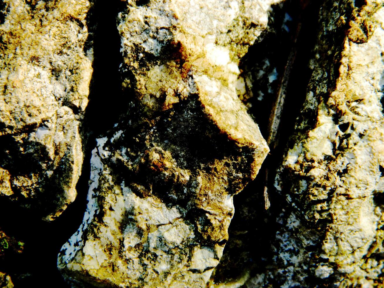 Abstract background with mountain rocks. Large shaped rocks that can be found on the shore of the sea, lake or river. photo