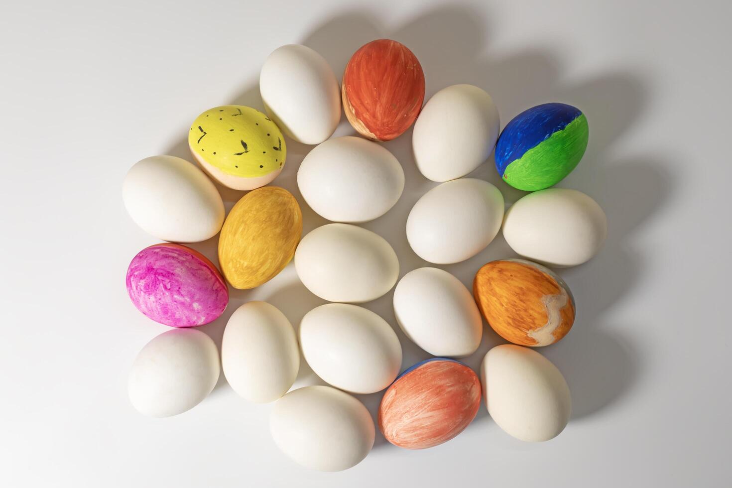 Colorful Easter eggs on white surface during Easter celebration. Happy easter. photo