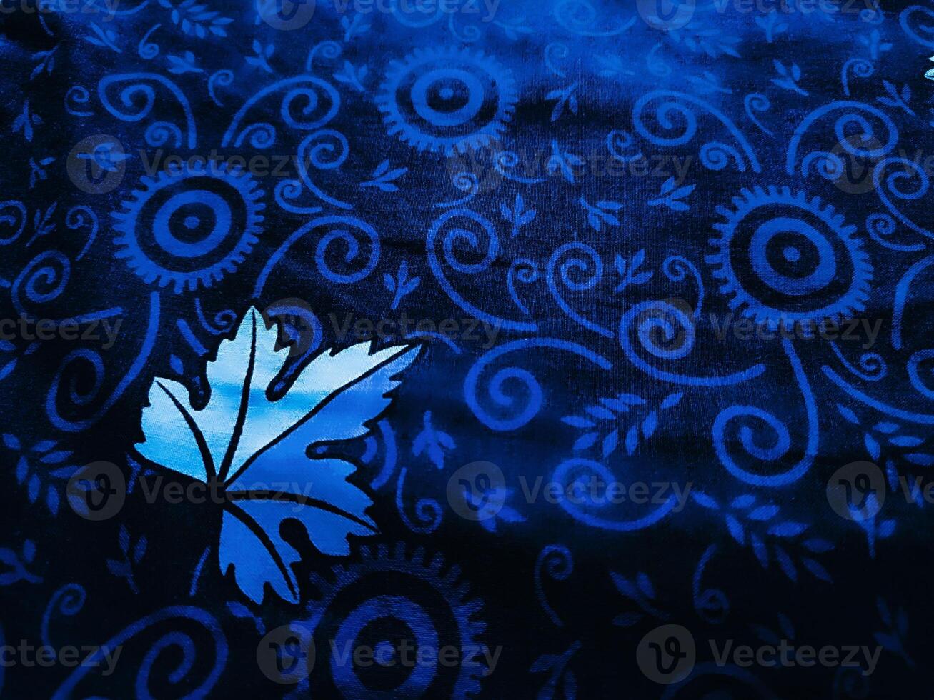 Blue fabric pattern and background with leaf design photo