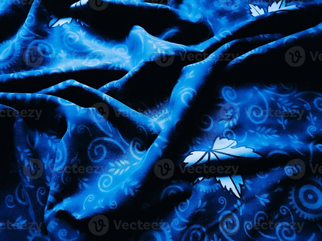 Blue fabric pattern and background with leaf design photo