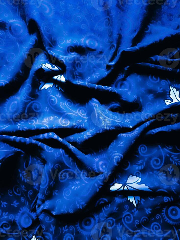 Blue fabric pattern and background with leaf design photo