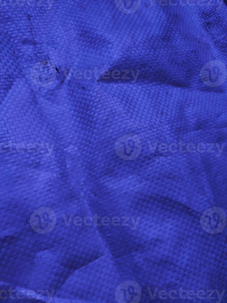 Blue sack texture and pattern. Arranged on a simple blue background. For banners, website covers photo