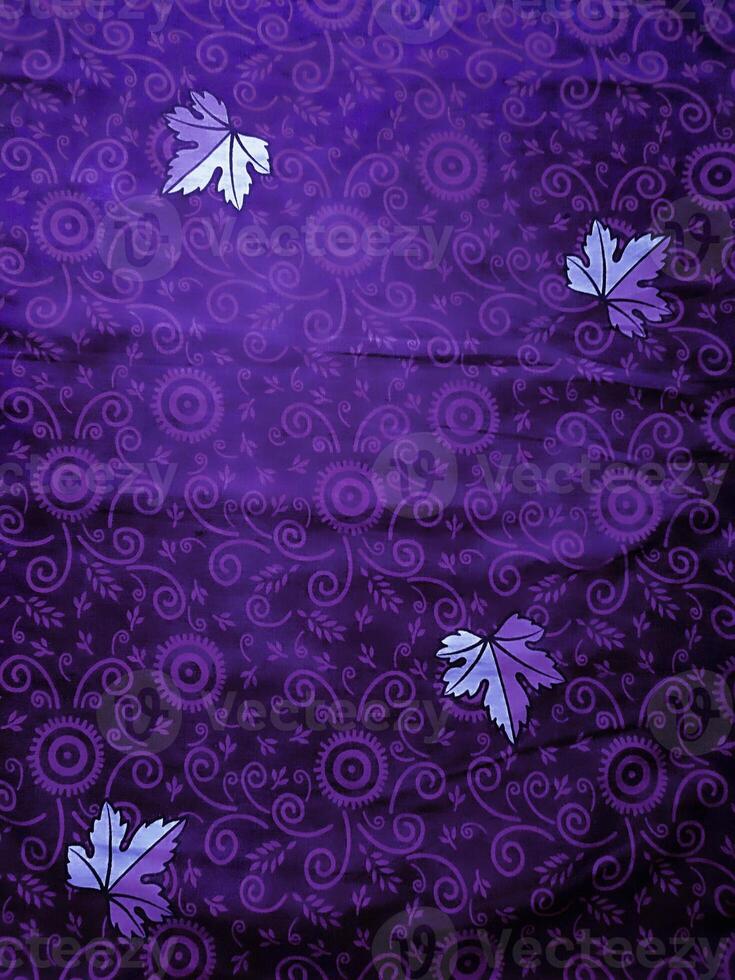 purple fabric pattern and background with leaf design photo