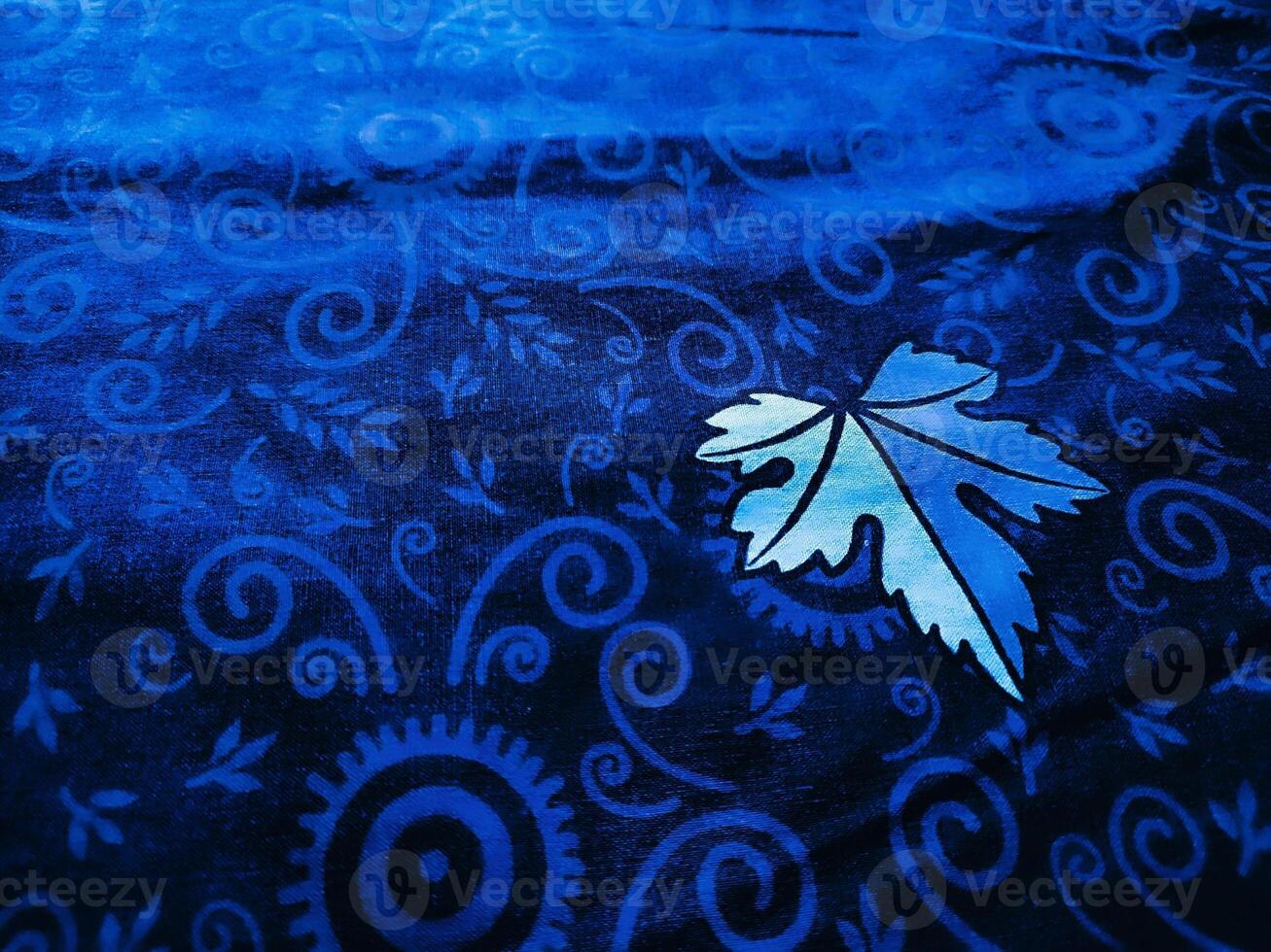 Blue fabric pattern and background with leaf design photo