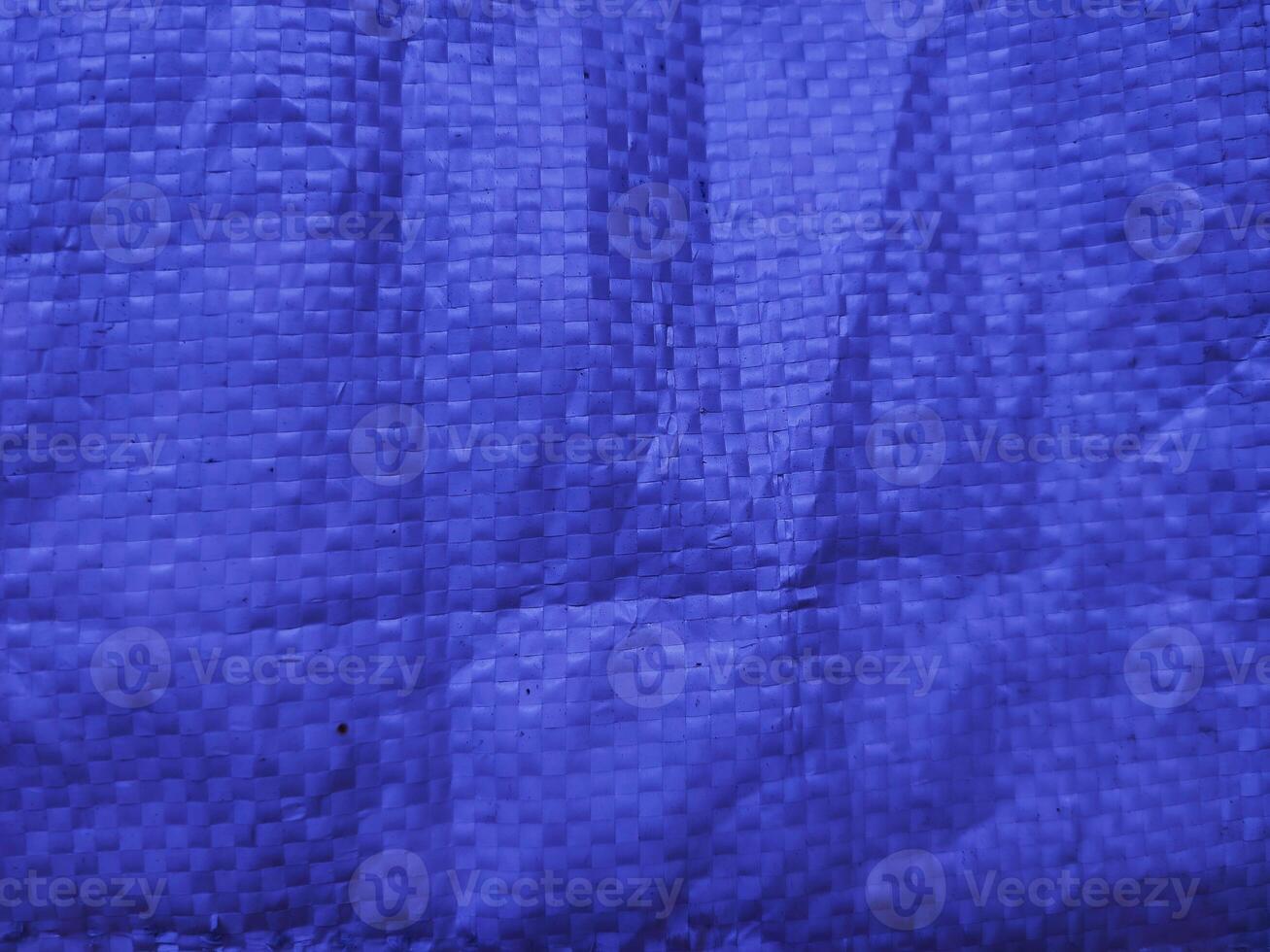 Blue sack texture and pattern. Arranged on a simple blue background. For banners, website covers photo