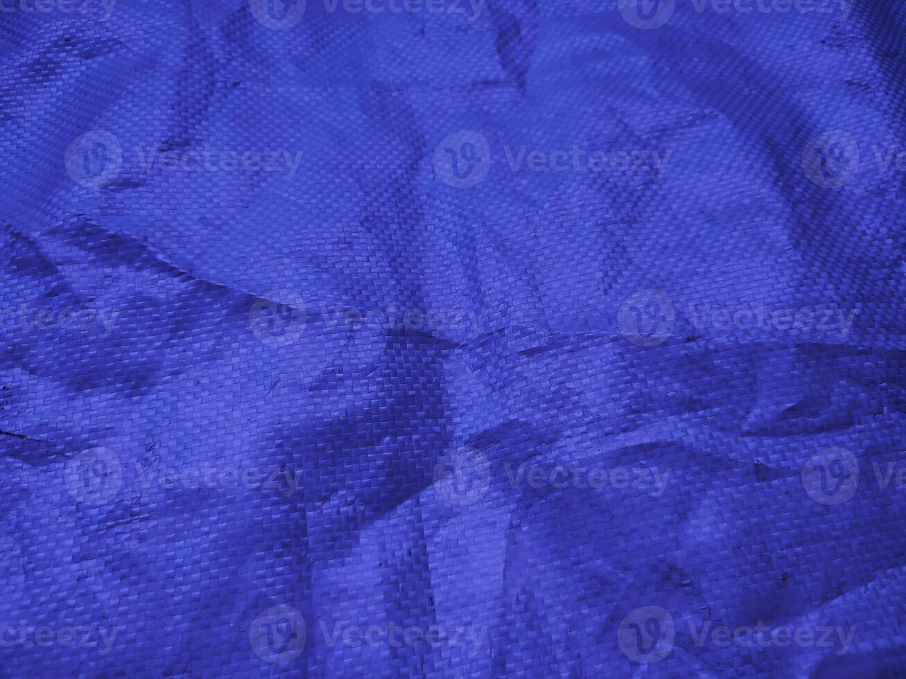 Blue sack texture and pattern. Arranged on a simple blue background. For banners, website covers photo