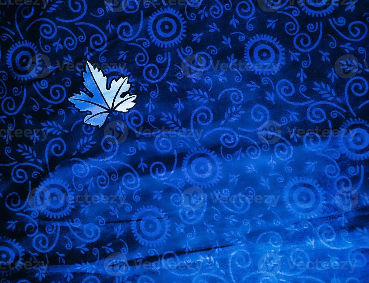Blue fabric pattern and background with leaf design photo