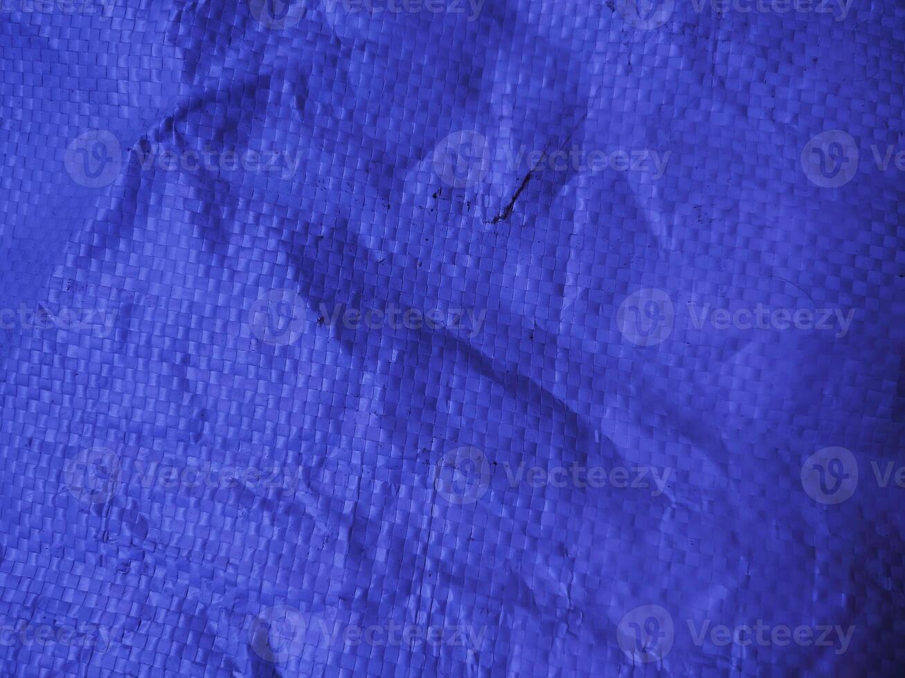Blue sack texture and pattern. Arranged on a simple blue background. For banners, website covers photo