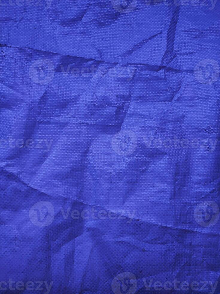 Blue sack texture and pattern. Arranged on a simple blue background. For banners, website covers photo