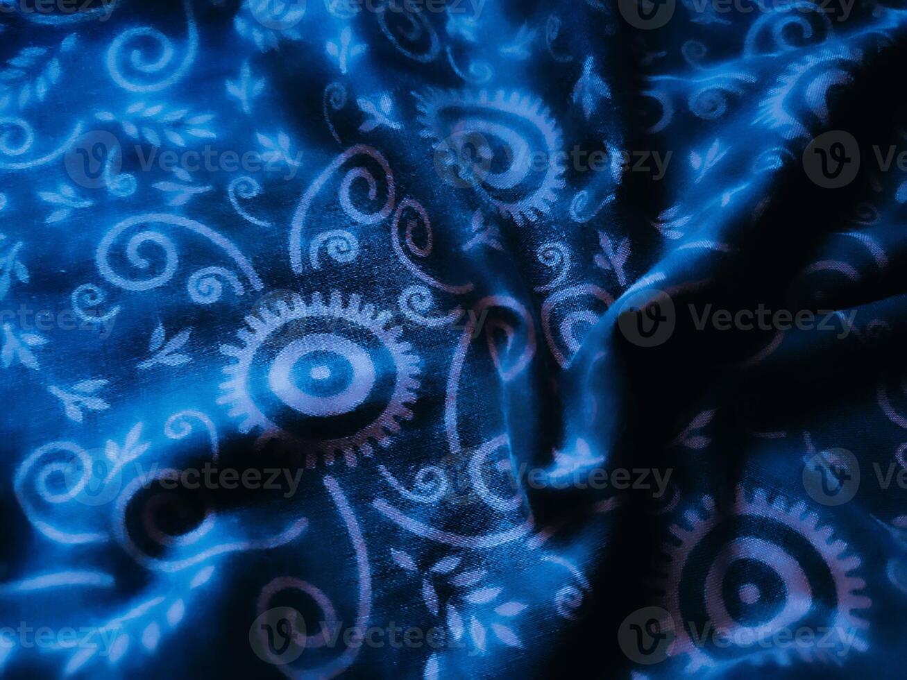 Blue fabric pattern and background with leaf design photo