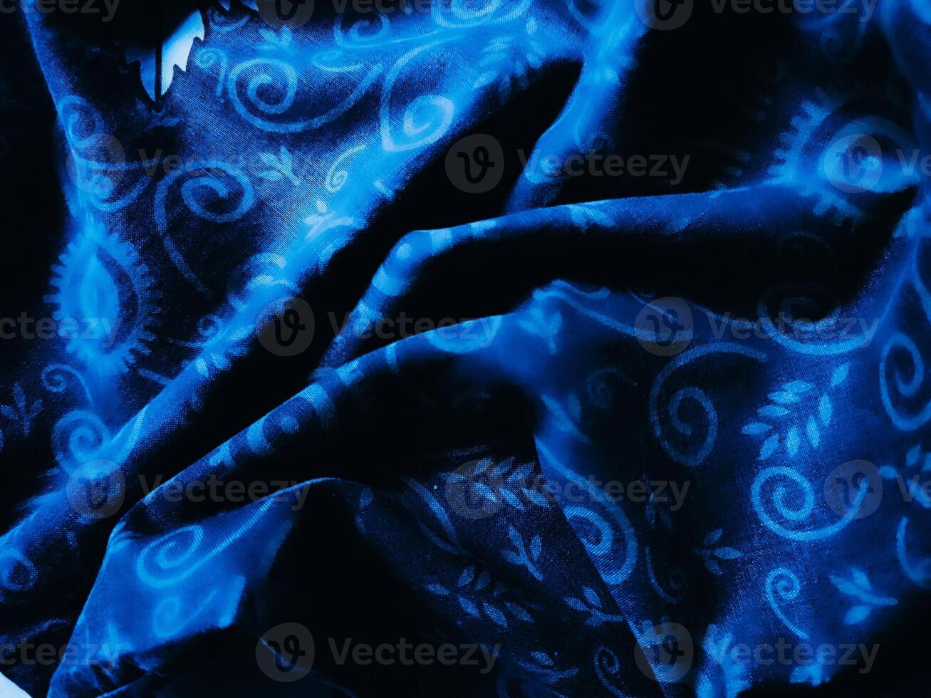 Blue fabric pattern and background with leaf design photo