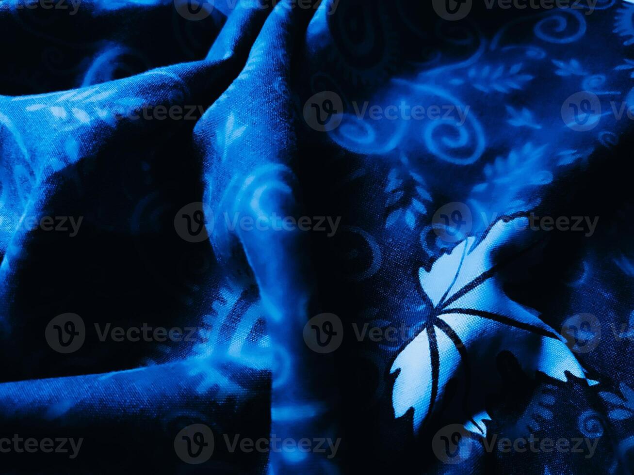 Blue fabric pattern and background with leaf design photo