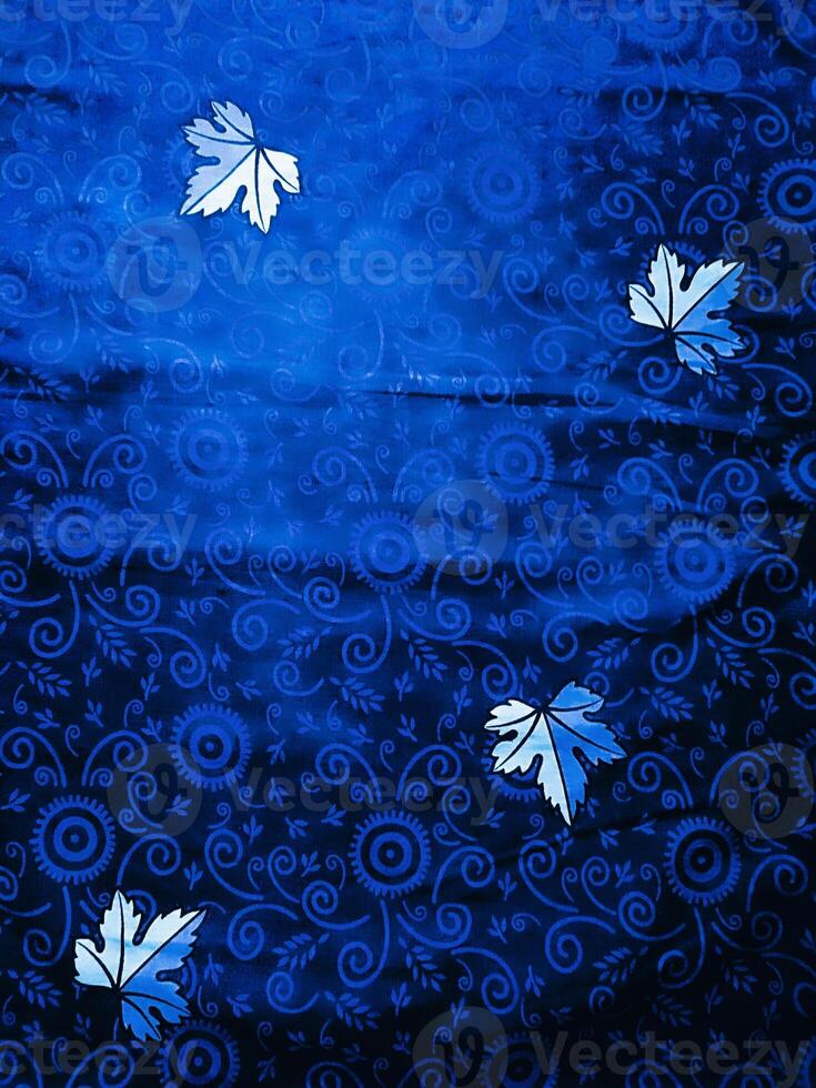 Blue fabric pattern and background with leaf design photo