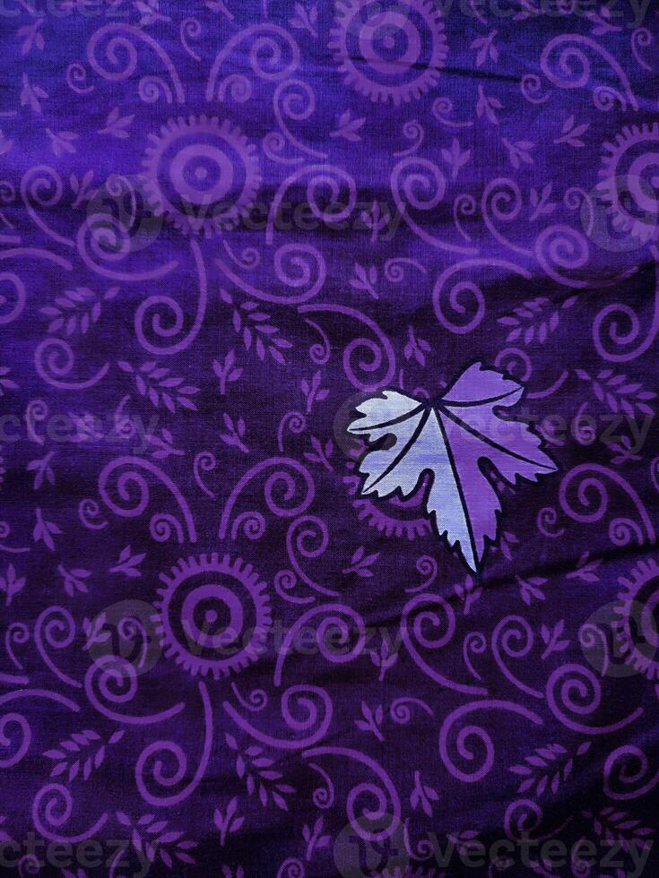 purple fabric pattern and background with leaf design photo