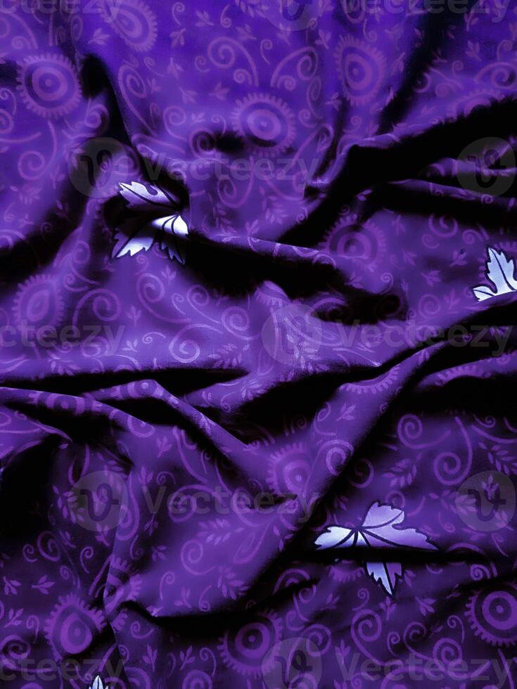 purple fabric pattern and background with leaf design photo
