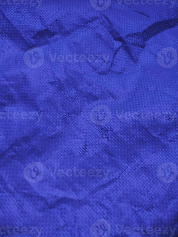 Blue sack texture and pattern. Arranged on a simple blue background. For banners, website covers photo