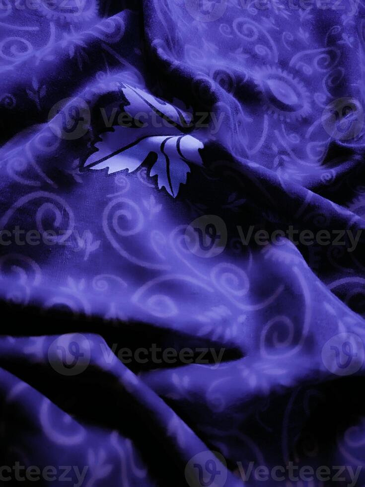 purple fabric pattern and background with leaf design photo