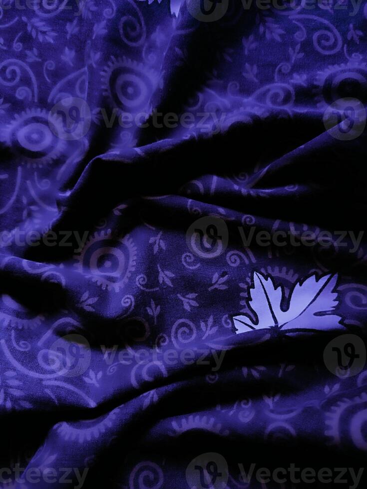 purple fabric pattern and background with leaf design photo