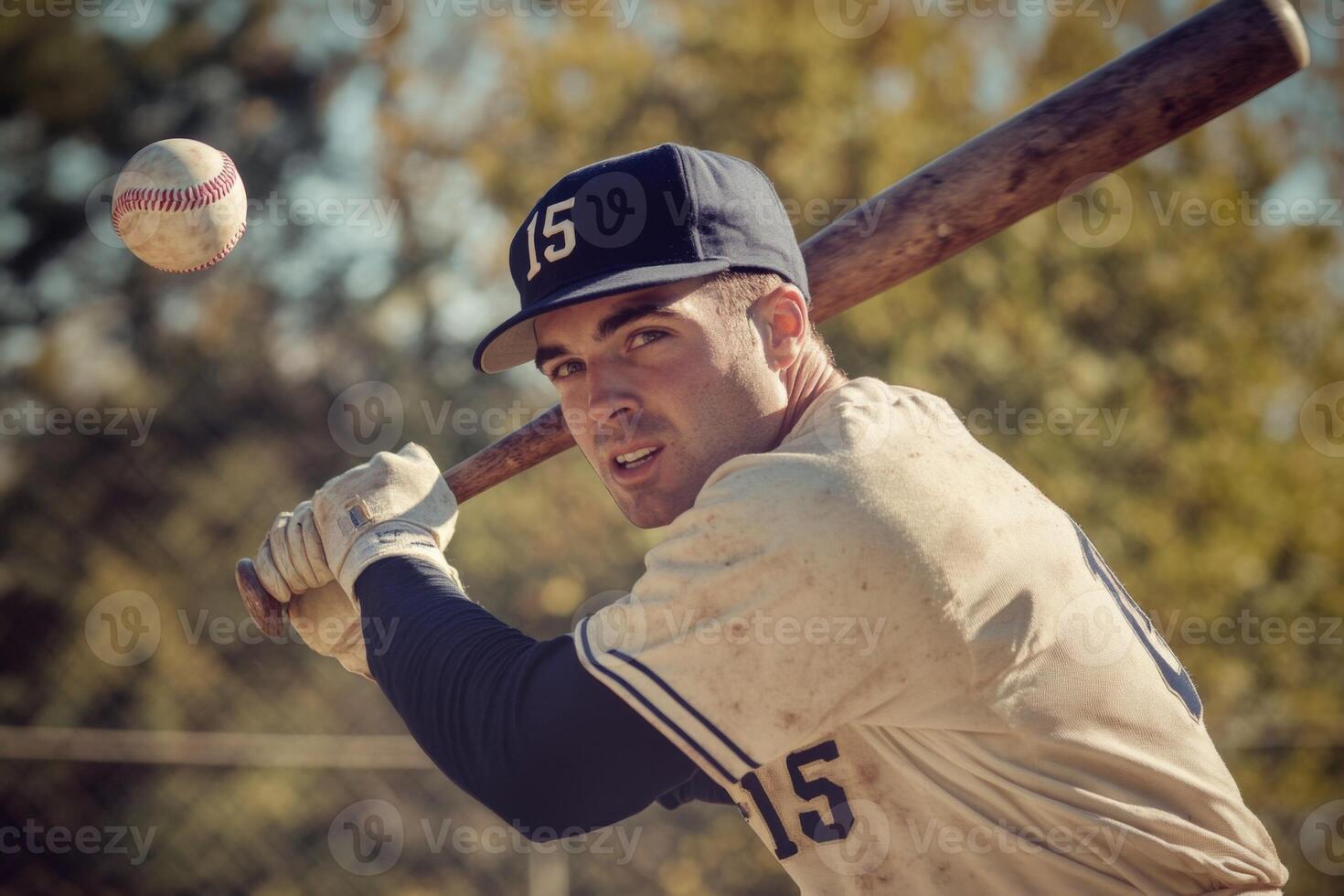 Baseball player taking a swing at a ball game photo