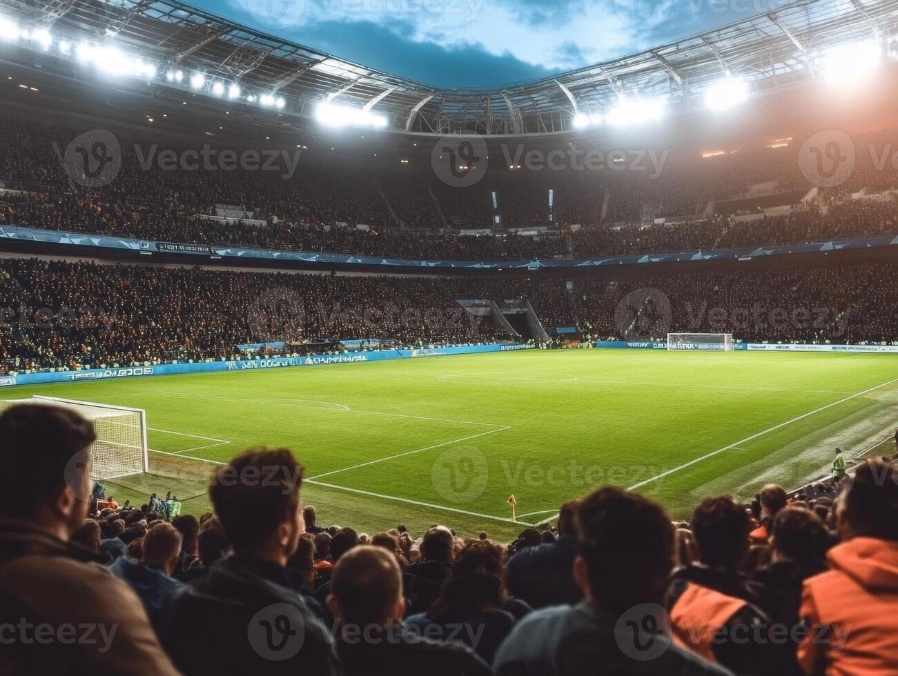 Crowd of spectators cheering during soccer game in stadium photo