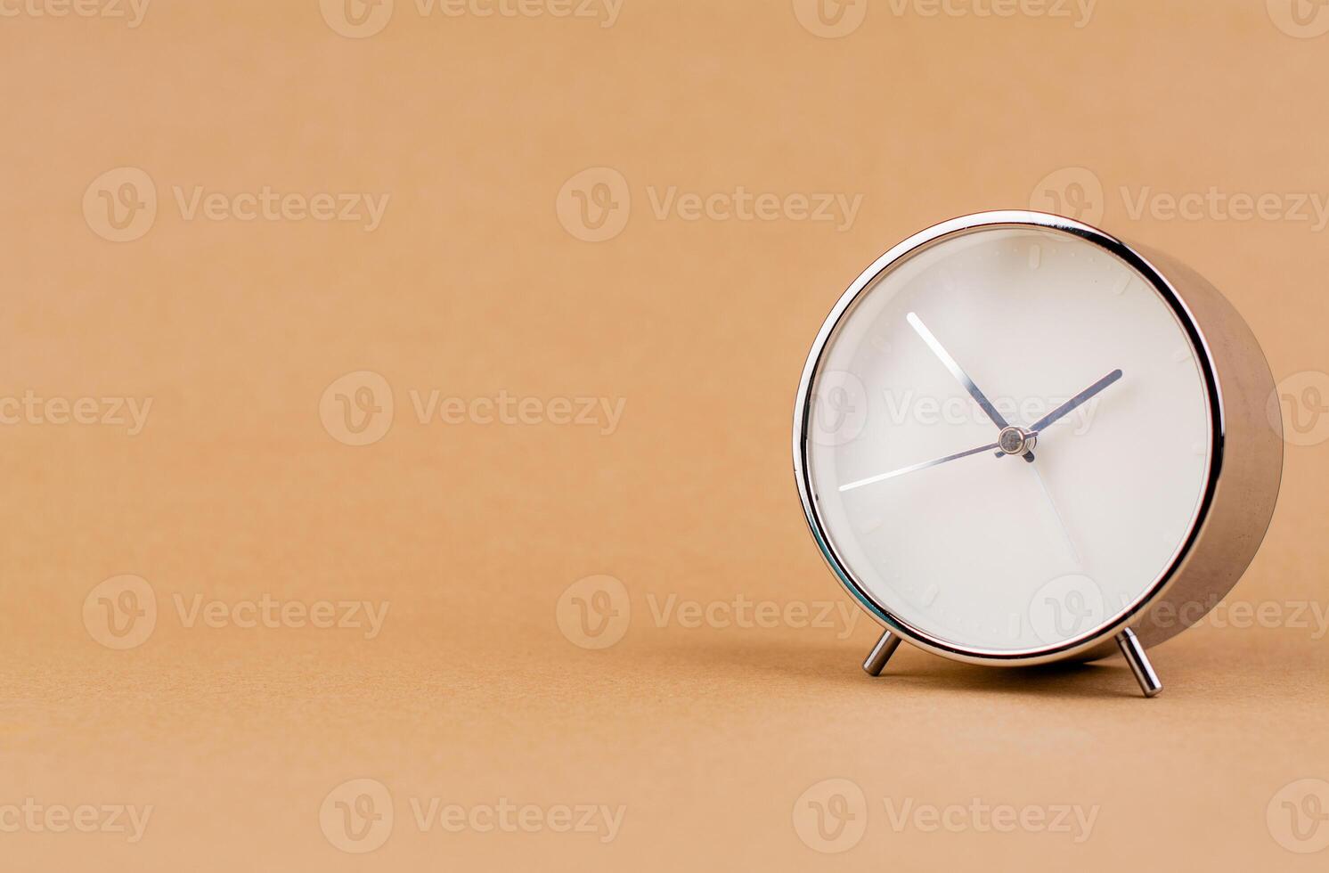 Alarm clock still photo in studio. Concept of time and working with valuable time.