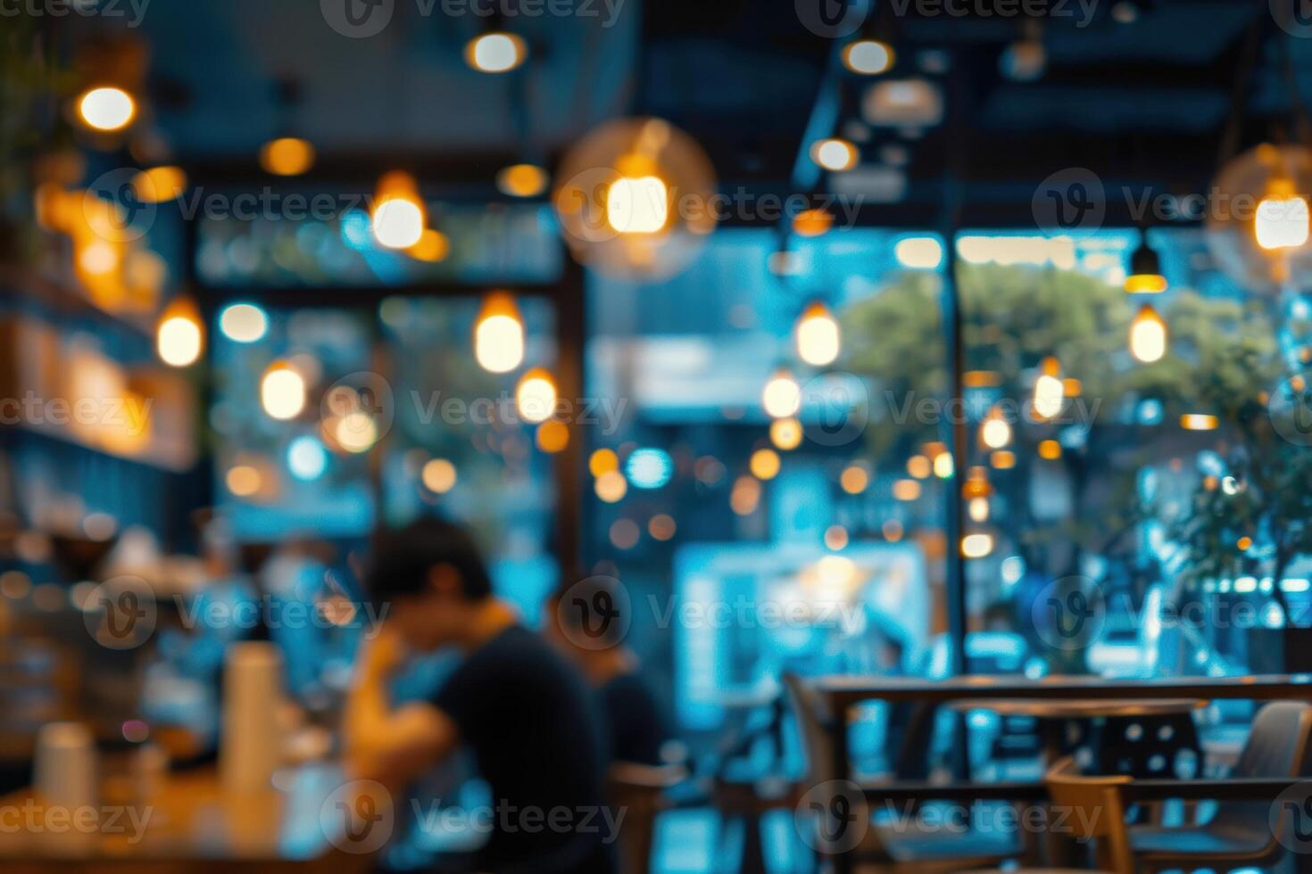 Blurred abstract atmospheric cafe background, soft lighting and cozy interior. photo