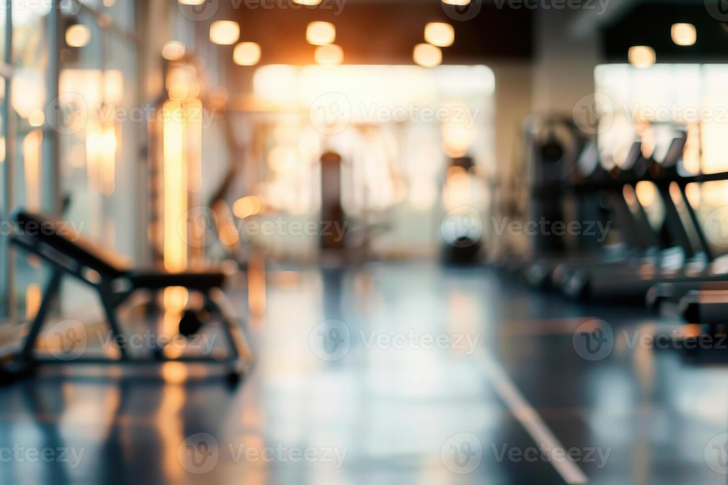 Blurred gym background with exercise machines, dynamic and energetic fitness space. photo