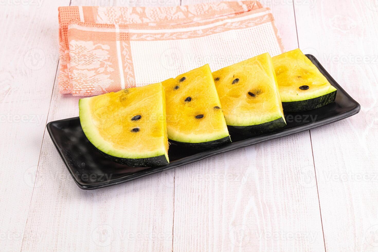 Sweet and juicy yellow watermelon slices photo