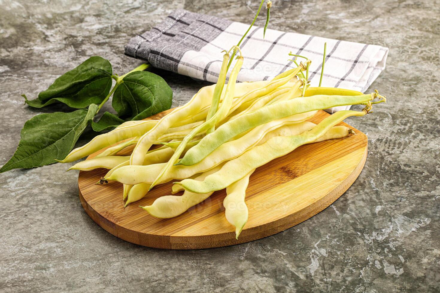 Raw green bean strings heap photo