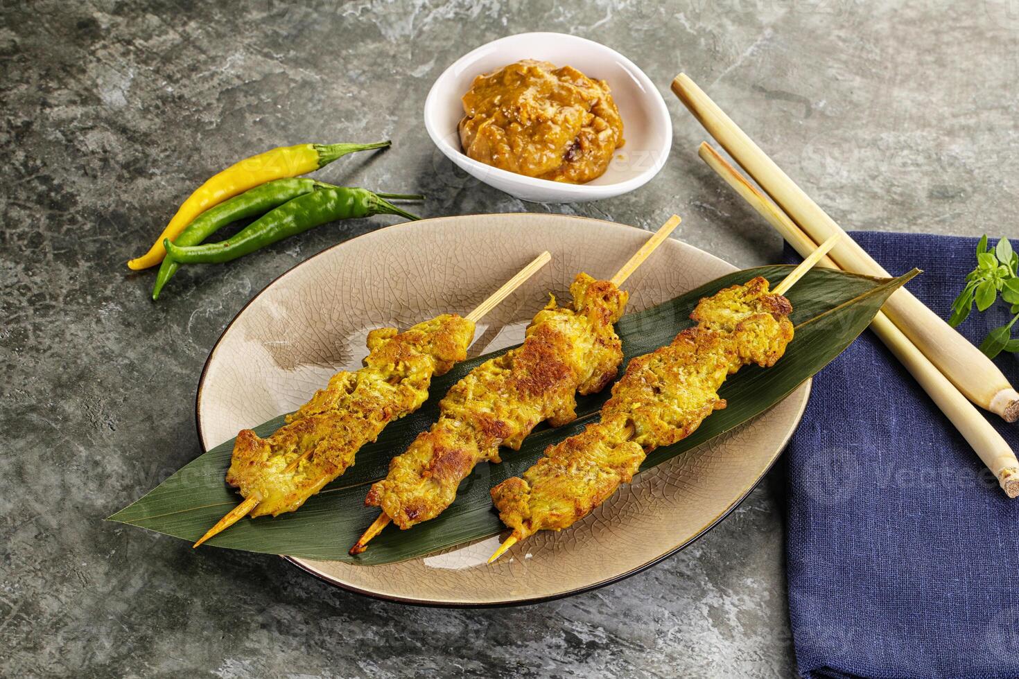 Thai meat skewer Satay with sauce photo