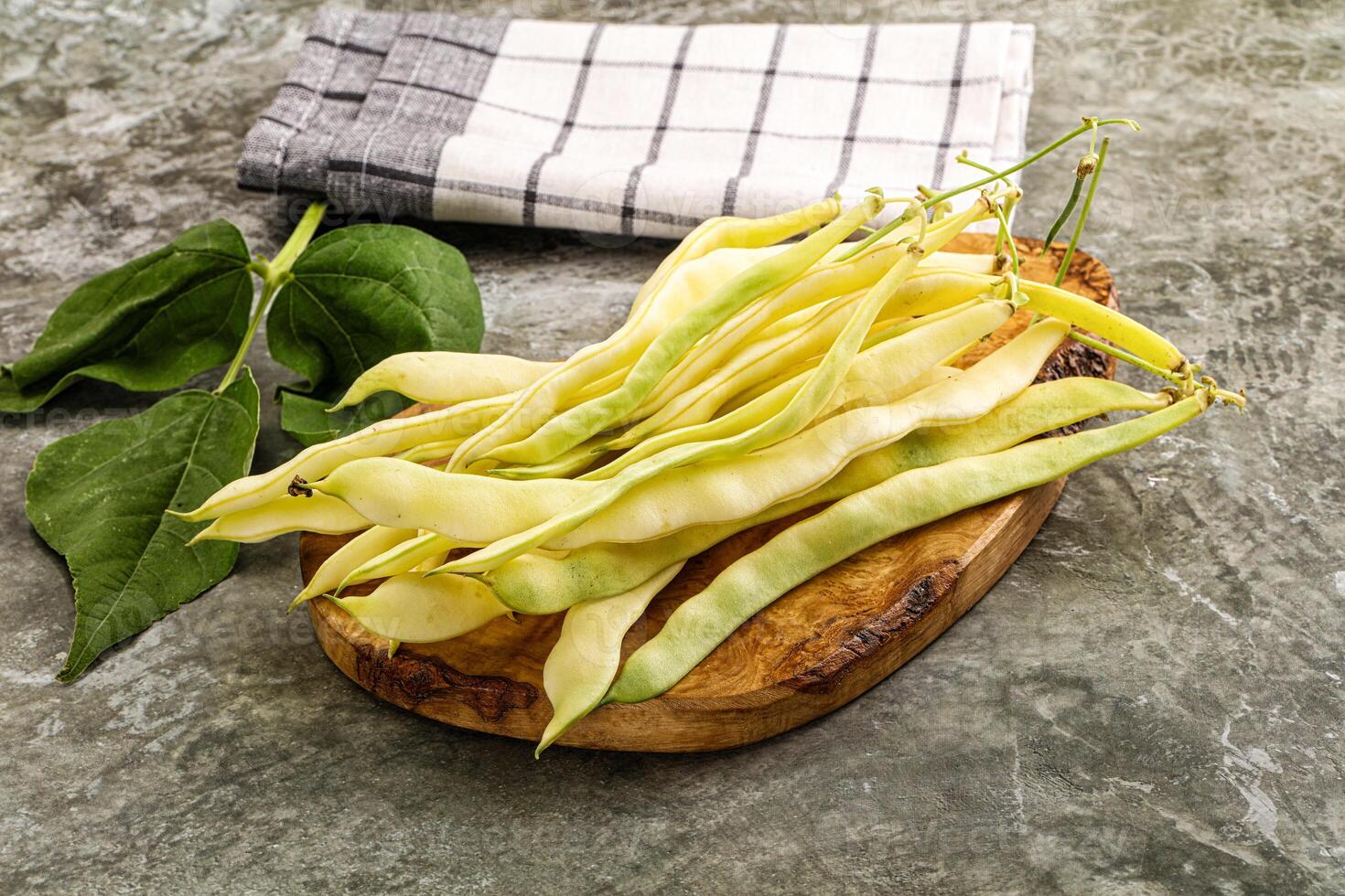 Raw green bean strings heap photo