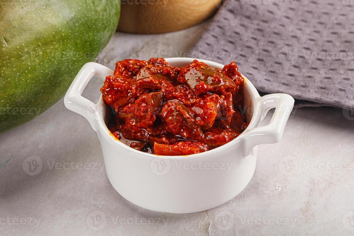 Spicy pickled raw green mango photo